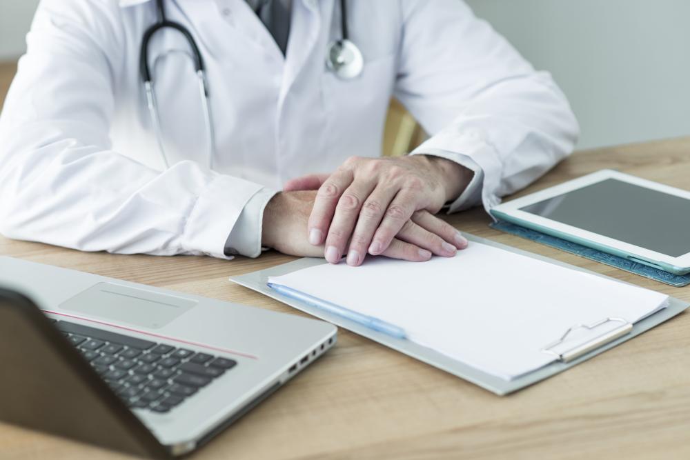 crop-doctor-sitting-near-devices-office-min